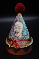Decorative, old 
clown box in 
painted 
cardboard, 
shaped like a 
tall circus hat 
with fabric ...