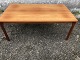 Coffee table in 
teak veneer 
with solid teak 
legs. Stamped: 
Møbelfabrikken 
"Toften" Made 
in ...