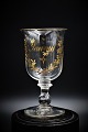 Old French 
Souvenir glass, 
decorated with 
gold writing 
"Souvenir" 
and flower 
vines. H:15cm. 
...