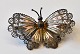 Brooch in the shape of a butterfly in filigree, 20th century. The wings are painted. Stamped .: ...