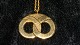Georg Jensen 
Year # 1992 
Ornament
Motif: Kringle
Gold plated
Nice and well 
maintained 
condition