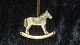 Georg Jensen 
Year # 1996 
Ornament
Motif: Rocking 
horse
Gold plated
Nice and well 
maintained ...