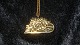 Georg Jensen 
Year # 2005 
Ornament
Motif: 
Toboggan with 
Christmas tree
Gold plated
Nice and ...