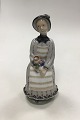 Royal 
Copenhagen 
figurine of 
Woman with 
Flowers. sifned 
by Georg 
Thylstrup No 
2156. Measures 
20 ...