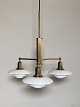 PH 2/1 "Stammekrone" lamp in burnished brass with shade set of mouth-blown, white opal glass. ...