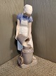 Royal 
Copenhagen 
Figurine of 
Girl with Milk 
Can No 2181. 
Measures 20 cm
