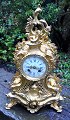 French nyrococo fireplace in gilded bronze, 19th century. Decorated with rocailles. Dial with ...
