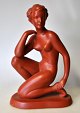 Austrian artist 20th century - presumably Gmunder Keramik: Sitting naked woman. Painted reds. ...
