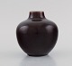 Royal 
Copenhagen vase 
in glazed 
ceramics. 
Beautiful ox 
blood glaze. 
Dated 1948.
Measures: 11 x 
...