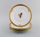 Five Royal 
Copenhagen 
Golden Basket 
plates in 
porcelain with 
flowers and 
gold 
decoration. 
Model ...