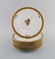 Eight Royal 
Copenhagen 
Golden Basket 
plates in 
porcelain with 
flowers and 
gold 
decoration. 
Model ...