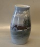 B&G 8790-244 
Vase with 
farmhouse 22 cm 
Bing and 
Grondahl Marked 
with the three 
Royal Towers of 
...