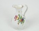 Bing & Grondahl 
small oil jug 
in the frame 
Saxon flower.
Dimensions in 
cm: H: 12 Dia: 
7
