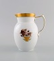 Royal 
Copenhagen 
Golden basket 
jug in 
porcelain with 
flowers and 
gold 
decoration. 
Model number 
...