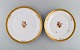 Two round Royal 
Copenhagen 
Golden Basket 
serving dishes 
in porcelain 
with flowers 
and gold ...