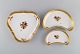 Three Royal 
Copenhagen 
Golden Basket 
dishes in 
porcelain with 
flowers and 
gold 
decoration. 
Early ...