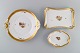 Three Royal 
Copenhagen 
Golden Basket 
dishes in 
porcelain with 
flowers and 
gold 
decoration. 
Early ...