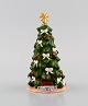 Royal 
Copenhagen 
porcelain 
figurine. The 
Annual 
Christmas Tree. 
2018.
Measures: 15 x 
8 cm
In ...