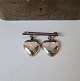 Vintage silver 
brooch with two 
hearts
Stamped: 830
Measure: 1.8 x 
2.7 cm.
