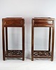 A set of Chinese side tables with drawer in polished dark wood from around the year 1880s. In ...
