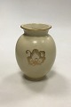 Royal 
Copenhagen Iron 
Porcelain Vase 
with Gold motif
Measures 
14,2cm / 5.59 
inch