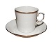 Royal 
Copenhagen 
White with wide 
gold edge, 
small demitasse 
coffeecup with 
matching 
saucer. It ...