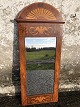 Faceted empire 
mirror, richly 
decorated with 
marquetry in 
Lemon wood. 
Some 
age-related 
traces on ...
