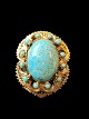 gilded silver 
brooch with 
turquoise