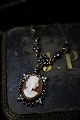 Old necklace 
with fine cameo 
and beautiful 
red garnets set 
in silver with 
chain. Length 
of ...