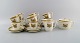Royal 
Copenhagen 
Golden Horns 
coffee service 
for 10 people. 
1960s.
Consisting of 
10 coffee cups 
...