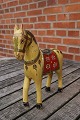 Wooden horse in 
painted wood 
from Sweden and 
with usage 
wear.
H 25.5cm - L 
23cm
