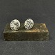 Diameter 1.5 
cm.
A pair of 
"rough" 
sterling silver 
ear clips from 
the 1970s.
They are ...