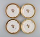 Four Royal 
Copenhagen 
Golden Basket 
plates in 
porcelain with 
flowers and 
gold 
decoration. 
Model ...