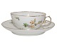 Royal 
Copenhagen tea 
cup with 
matching 
saucer. It is 
decorated with 
flowers - also 
on the inside 
...