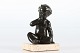 Just Andersen Figure D 2326 made of disco metal with patina of a naked boy sitting on a ...