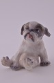 Dahl Jensen 
porcelain 
figurine. DJ  
Pekinese puppy 
no. 1134. 
Height 7 cm. 
Lengtht 8  cm. 
1. ...