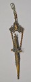 Pendant with 
small scissors, 
19th century. 
Designed in 
brass like a 
sword. Numerous 
details with 
...