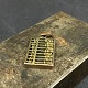 Length 2.3 cm.
Width 1.2 cm.
Miniature 
abacus made of 
brass and 
copper with the 
eyelet as a ...