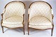 A set of two louise seize chairs in polished mahogany with brightly decorated fabric from the ...