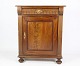 Mahogany console cabinet with drawer and door from around the year 1860s. The console cabinet is ...