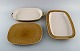 Jens H. Quistgaard (1919-2008) for Bing & Grøndahl. Three Relief serving dishes 
in glazed stoneware. Beautiful glaze in mustard yellow shades. 1960s.
