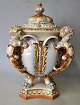 German faience 
lid jar, 19th 
century. Jar on 
four lion legs, 
4 handles in 
the shape of 
angels, ...