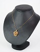 Pendant, 
designed by 
Flora Danica in 
gold-plated 
silver. 
Necklace is not 
included, but 
can be ...