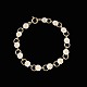 Bernhard Hertz. Gilded Sterling Silver Daisy Bracelet with White Enamel. 7mmCrafted by ...