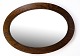 Antique oval mirror in dark stained oak from around the 1910s.Dimensions in cm: H:74 W:103