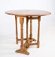 Bright folding table in oak wood from around the 1890s.Measurements in cm: H:62.5 W:75 D:60