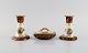 Two 
candlesticks 
and ink dryer 
in hand-painted 
porcelain. 
Romantic scenes 
and gold 
decoration. ...