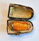 Cigar tube in 
milk amber, 
19th century 
Denmark. With 
collar of 
silver. L .: 
3.4 cm. With 
...