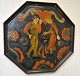Norwegian 
octagon painted 
tray, 20th 
century. Motif 
of a man and 
woman standing 
by a pot and 
...