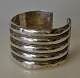 Sølv armbånd i 
sterling sølv, 
20. årh. 
Stemplet. 
Indvendig 
diameter: 6 cm. 
Højde.: 4,4 ...